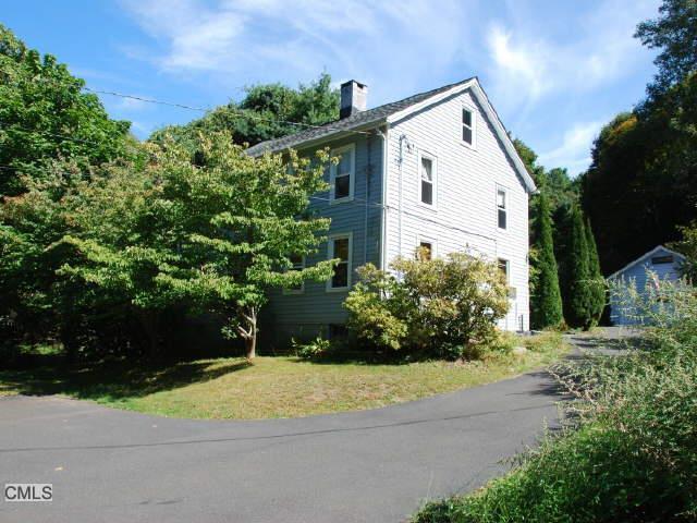 76 Glen Road Newtown, CT 06482 - Photo 1 of 1 a view of a white house with a yard and plants