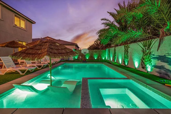 a view of a yard with swimming pool