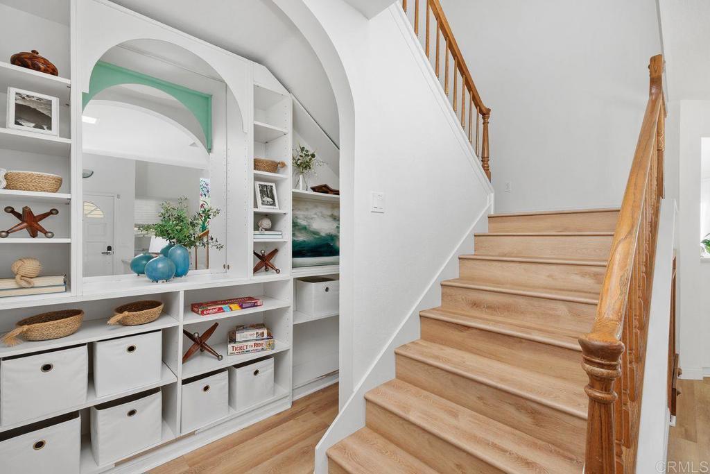 7013 Lavender Way Carlsbad, CA 92011 - Photo 18 of 51 a view of entryway and hall with wooden floor