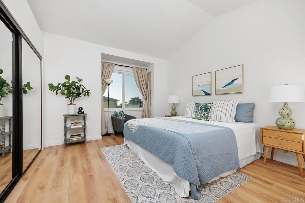 7013 Lavender Way Carlsbad, CA 92011 - Photo 20 of 51 a bedroom with a large bed and a tv