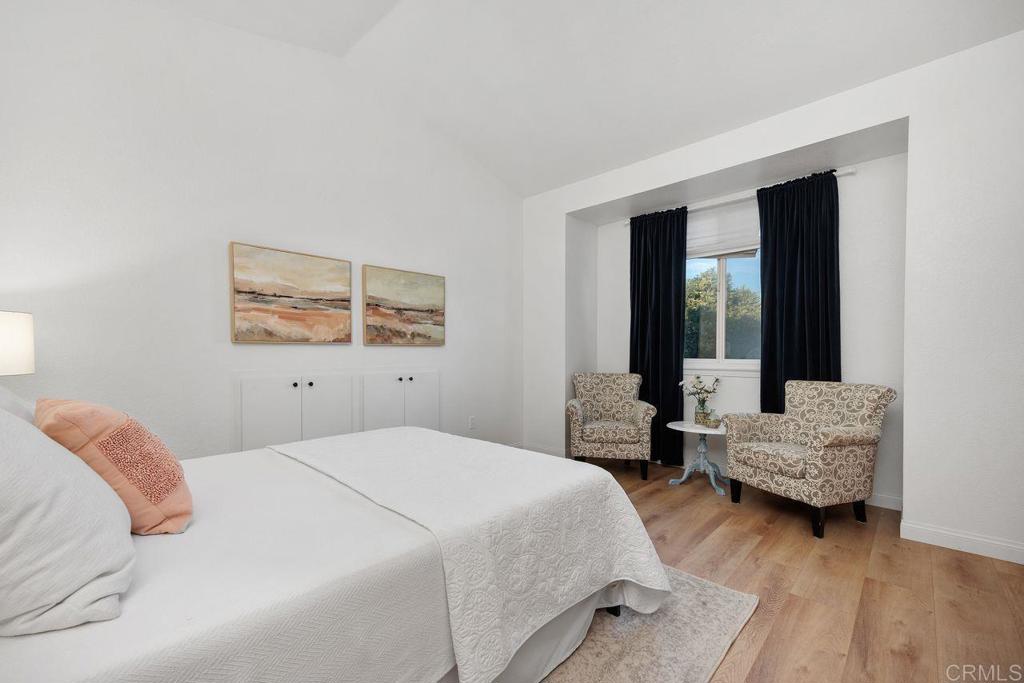 7013 Lavender Way Carlsbad, CA 92011 - Photo 24 of 51 a bedroom with a bed and a couch