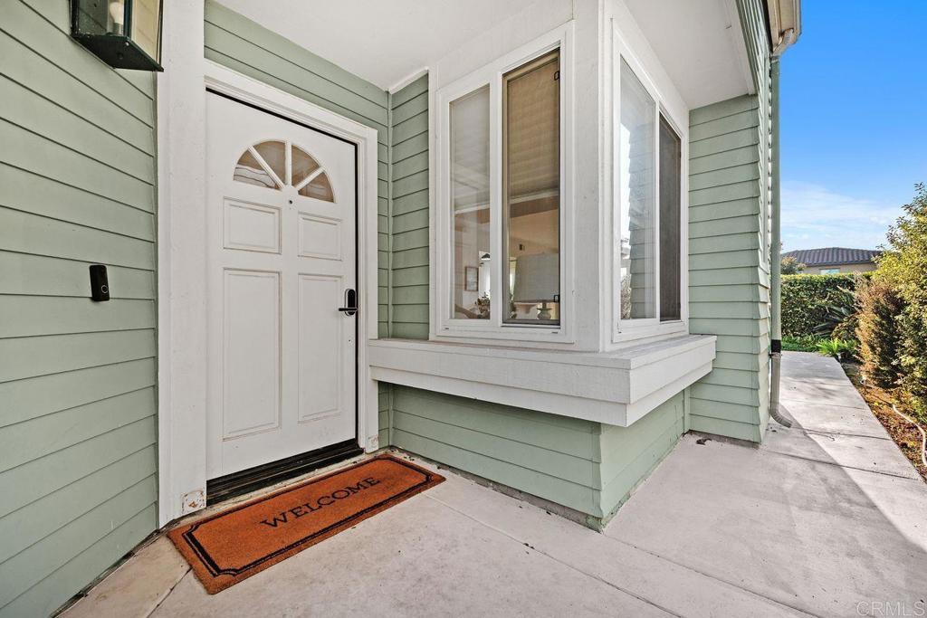 7013 Lavender Way Carlsbad, CA 92011 - Photo 51 of 51 a bench sitting in front of a door