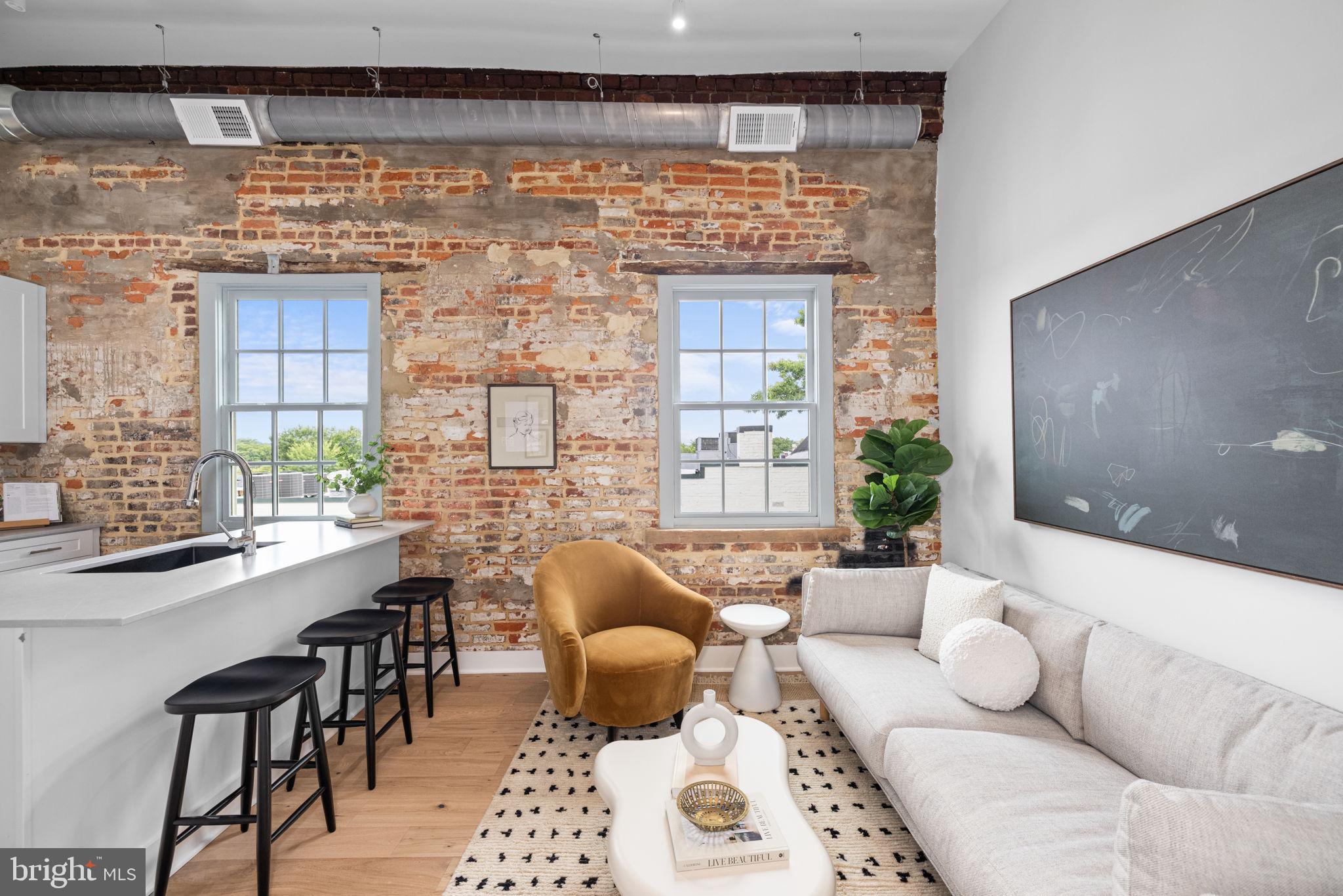 a living room with furniture and a table