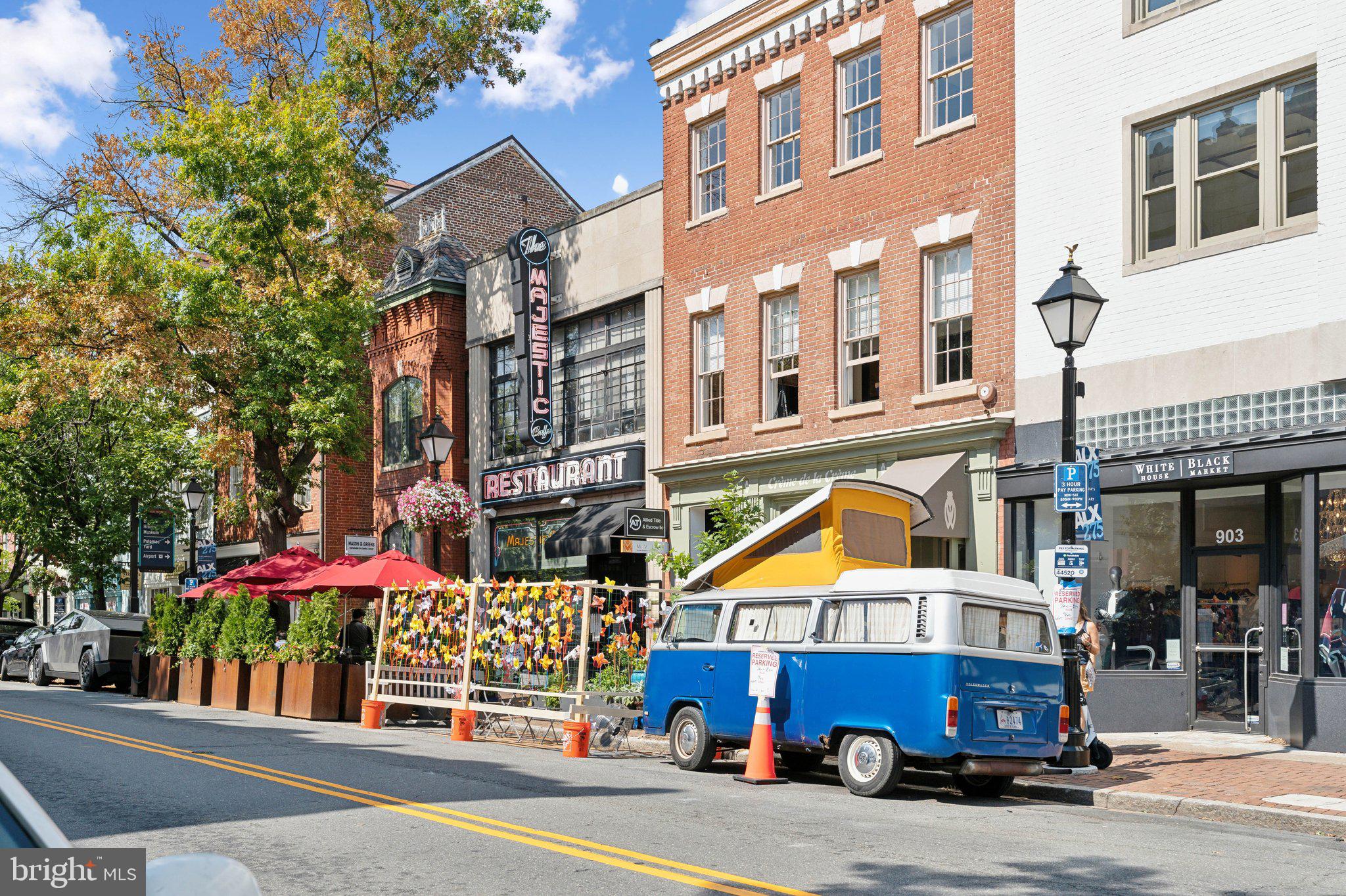 901 King Street, Unit 401 Alexandria, VA 22314 - Photo 22 of 32 a view of a building with a yard and sitting area