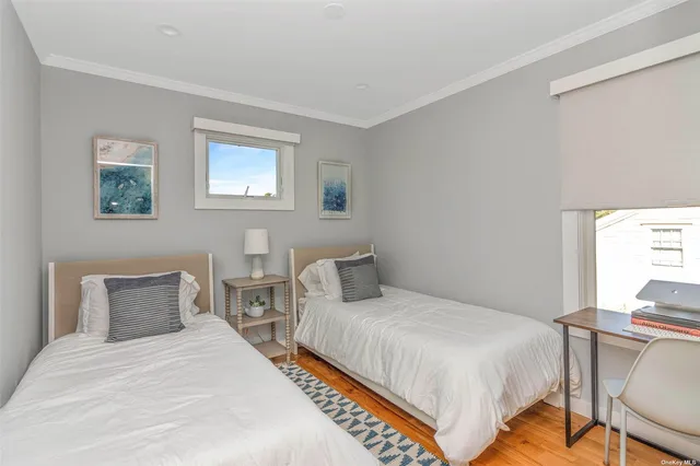 a bedroom with bed and a window