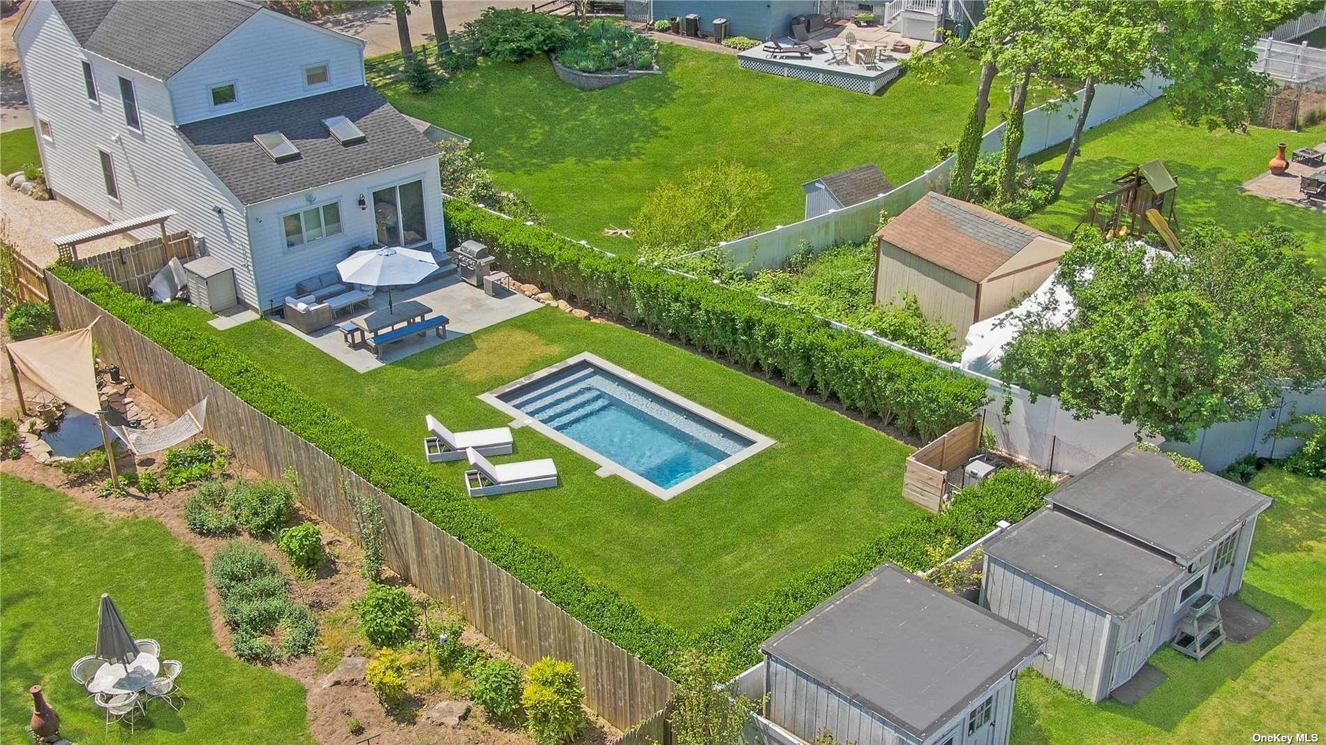 155 Bridge Street Greenport, NY 11944 - Photo 26 of 30 an aerial view of a house with a garden