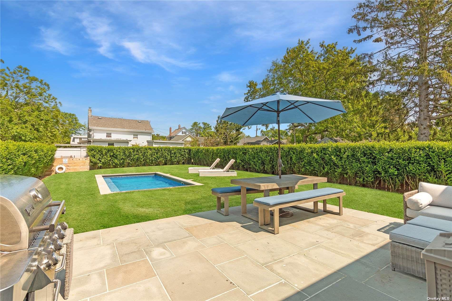 155 Bridge Street Greenport, NY 11944 - Photo 27 of 30 a view of a backyard with sitting area