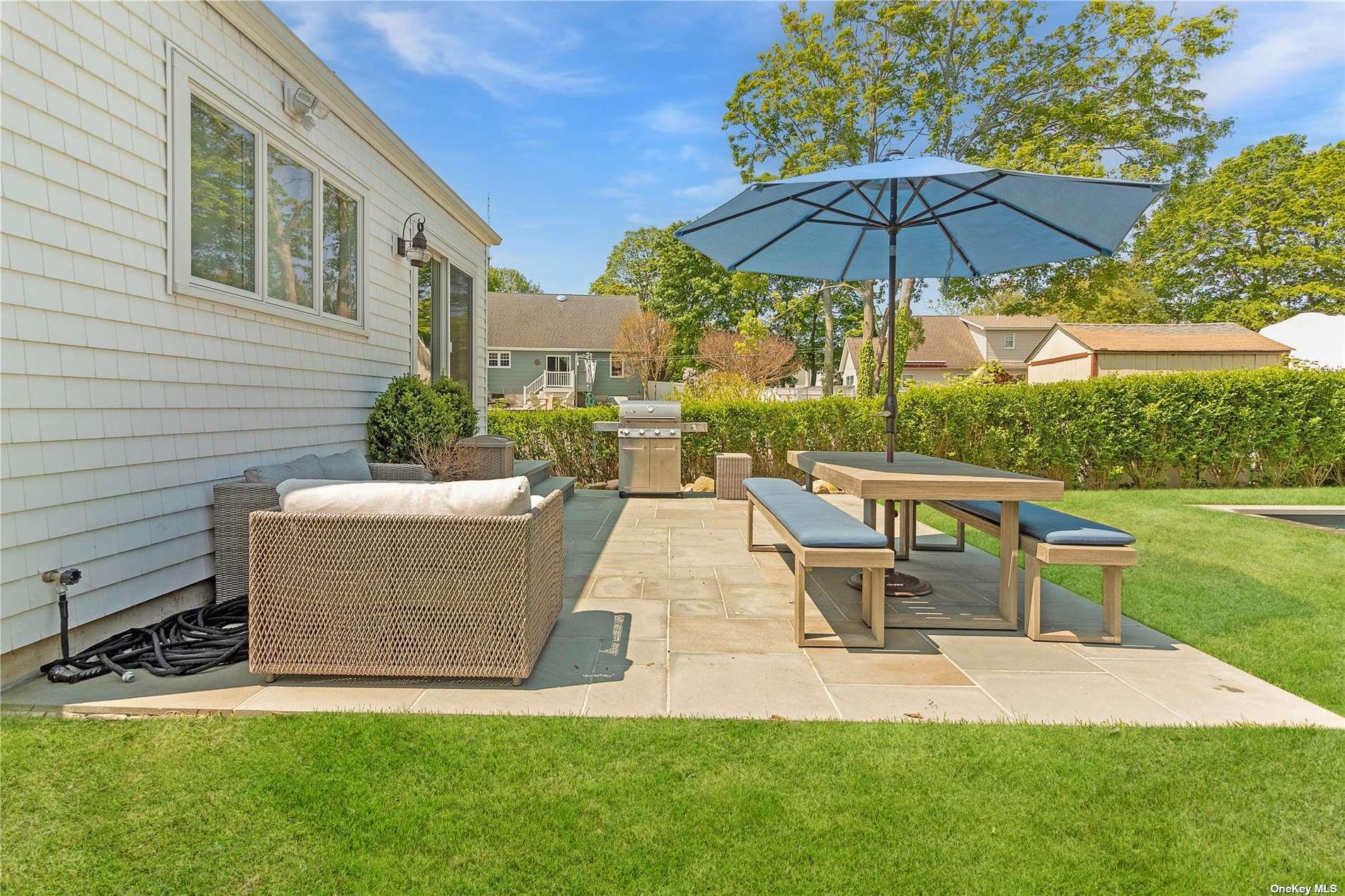 155 Bridge Street Greenport, NY 11944 - Photo 3 of 30 a view of a house with a yard and sitting area