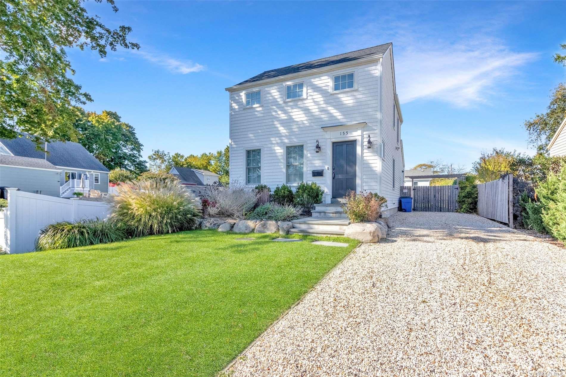 155 Bridge Street Greenport, NY 11944 - Photo 4 of 30 a view of a house with fountain and garden