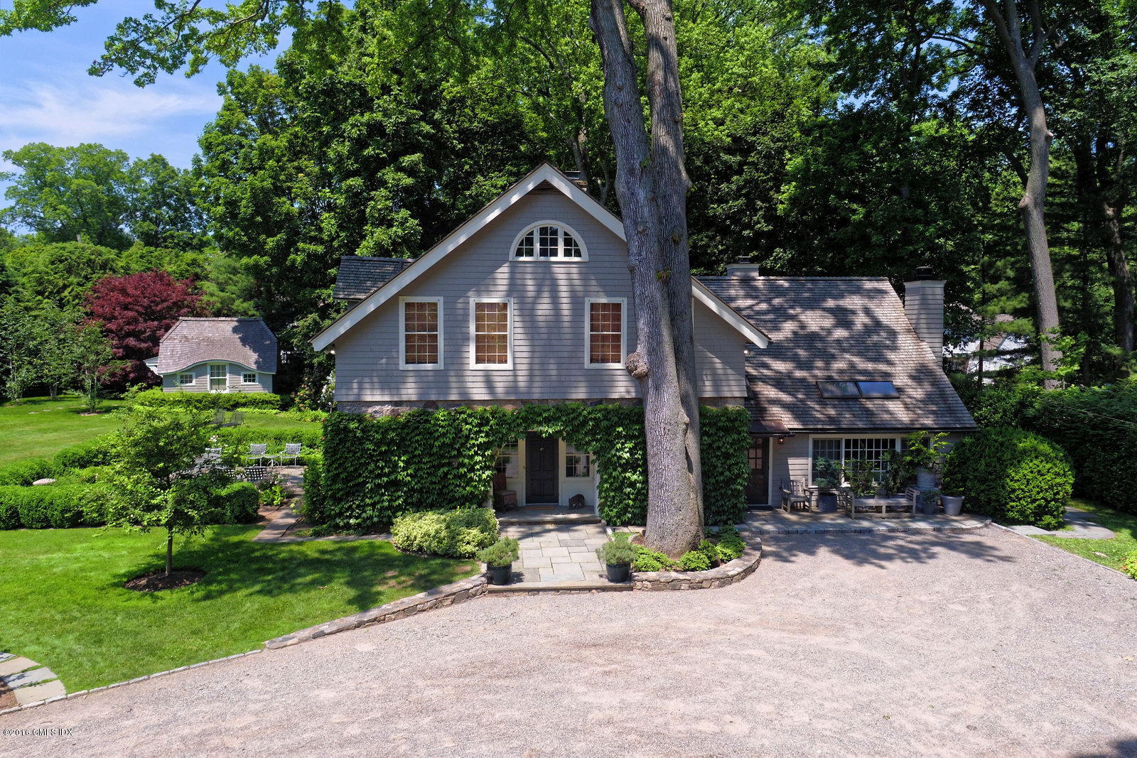 25 Leeward Lane Riverside, CT 06878 - Photo 2 of 19 a front view of a house with garden