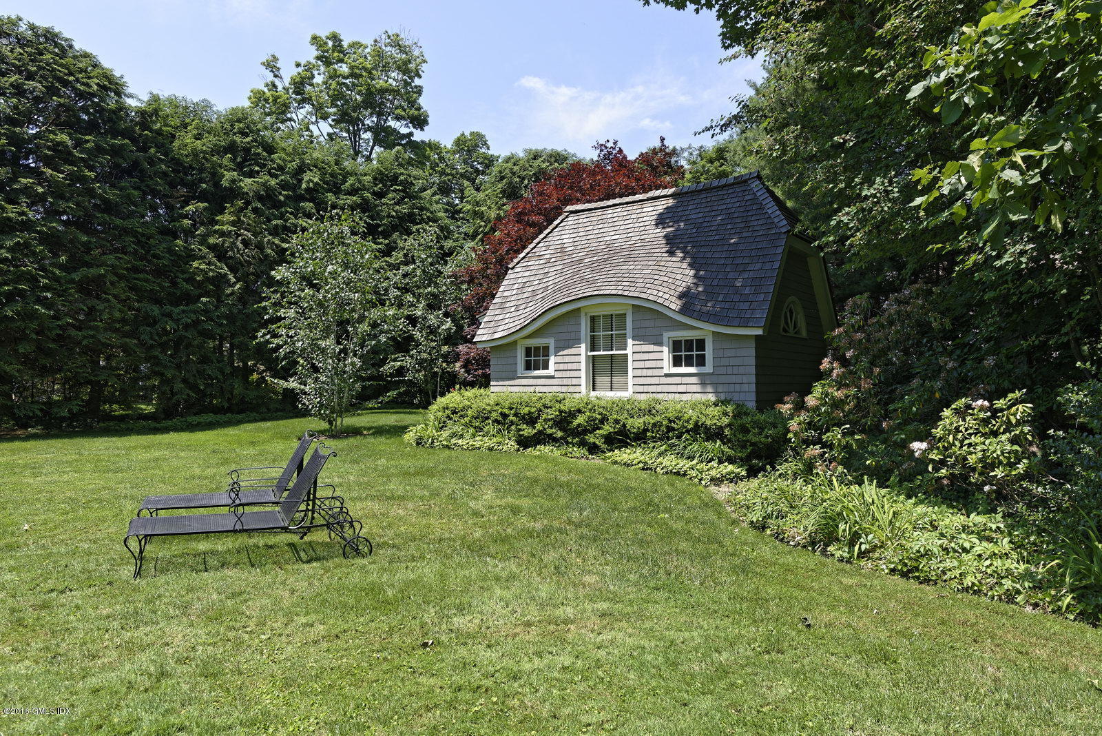 25 Leeward Lane Riverside, CT 06878 - Photo 4 of 19 a front view of a house with a yard