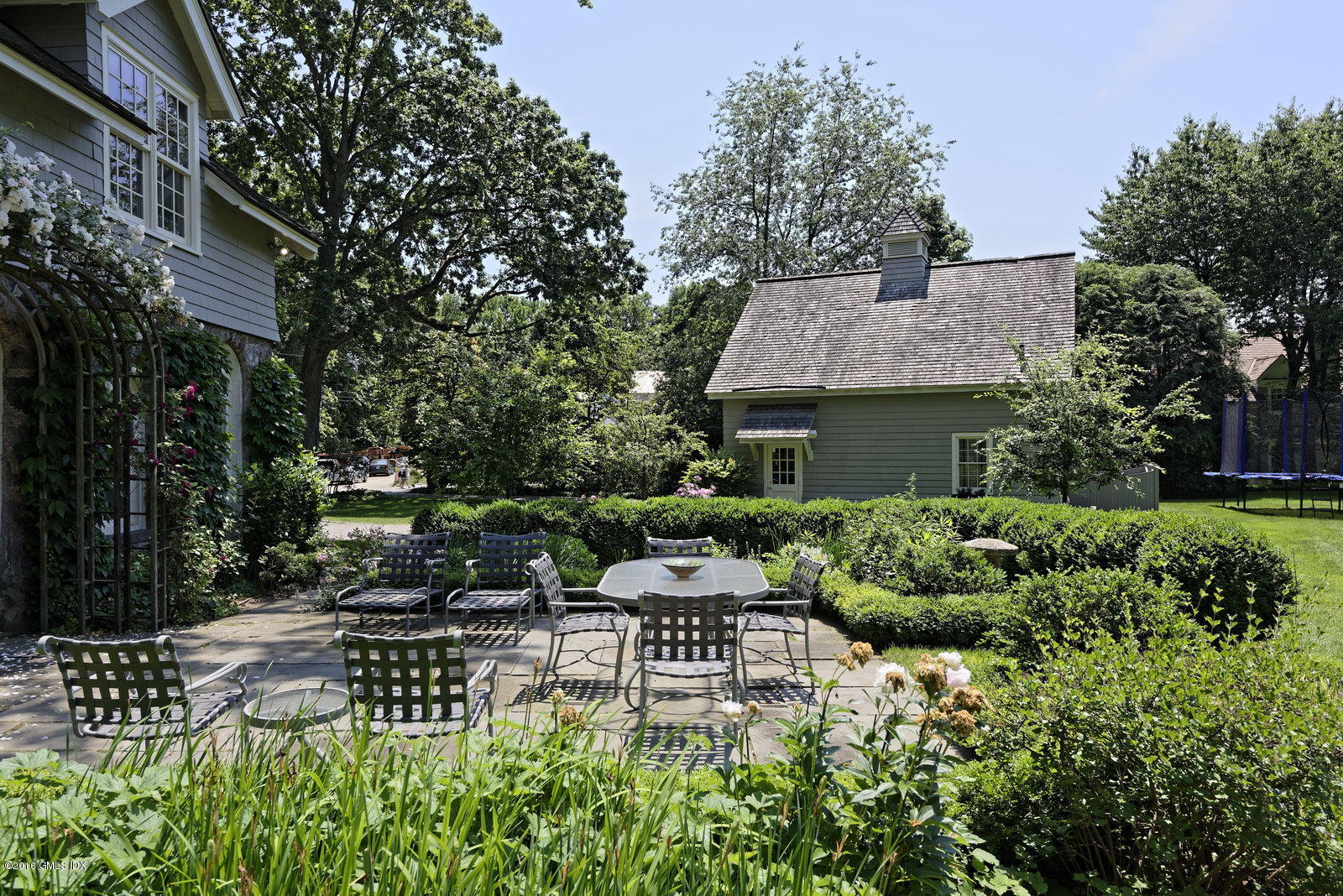 25 Leeward Lane Riverside, CT 06878 - Photo 5 of 19 a front view of a house with a garden
