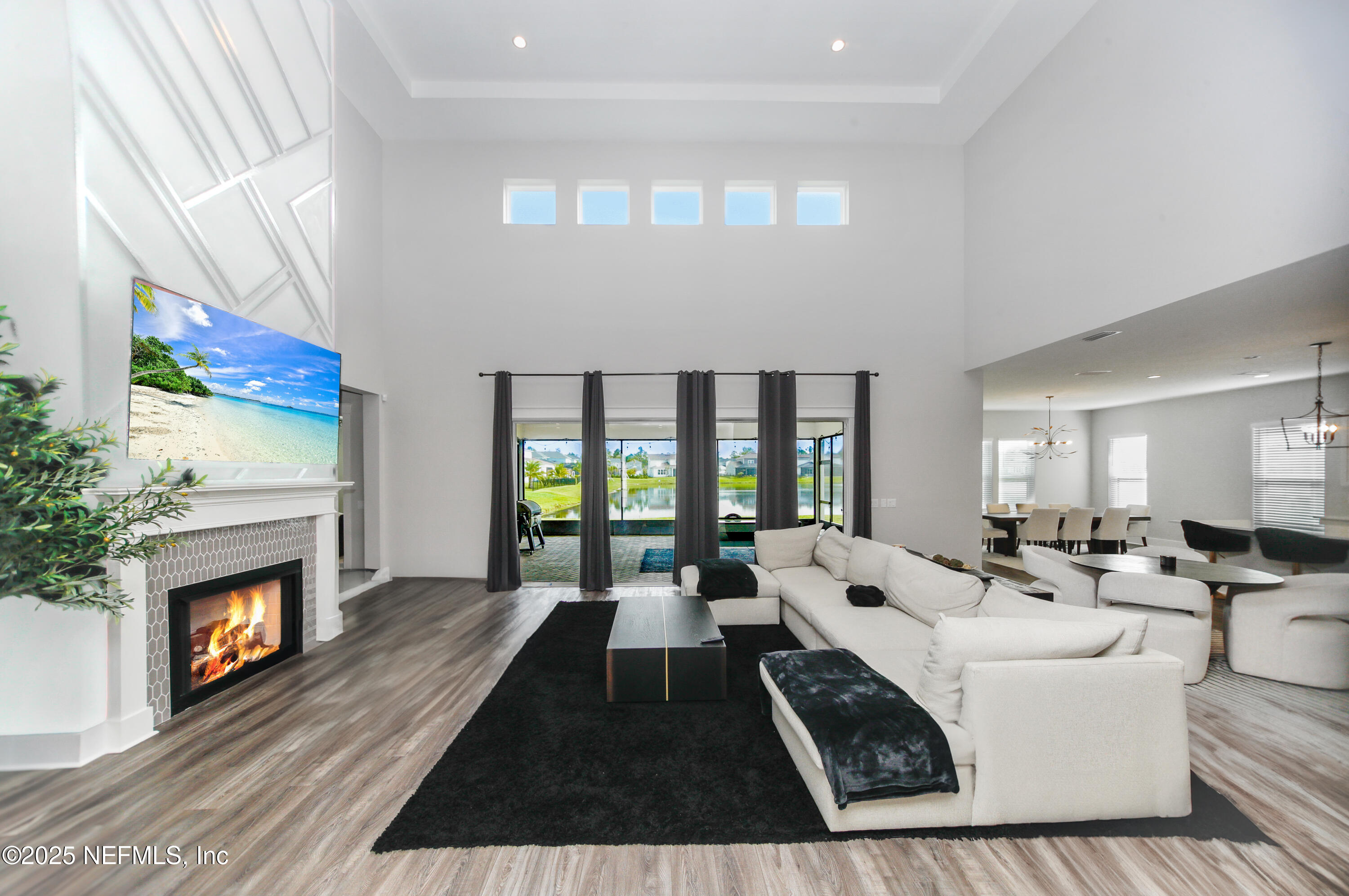 151 Hillendale Circle St. Johns, FL 32259 - Photo 5 of 39 a large living room with furniture fireplace and a large window