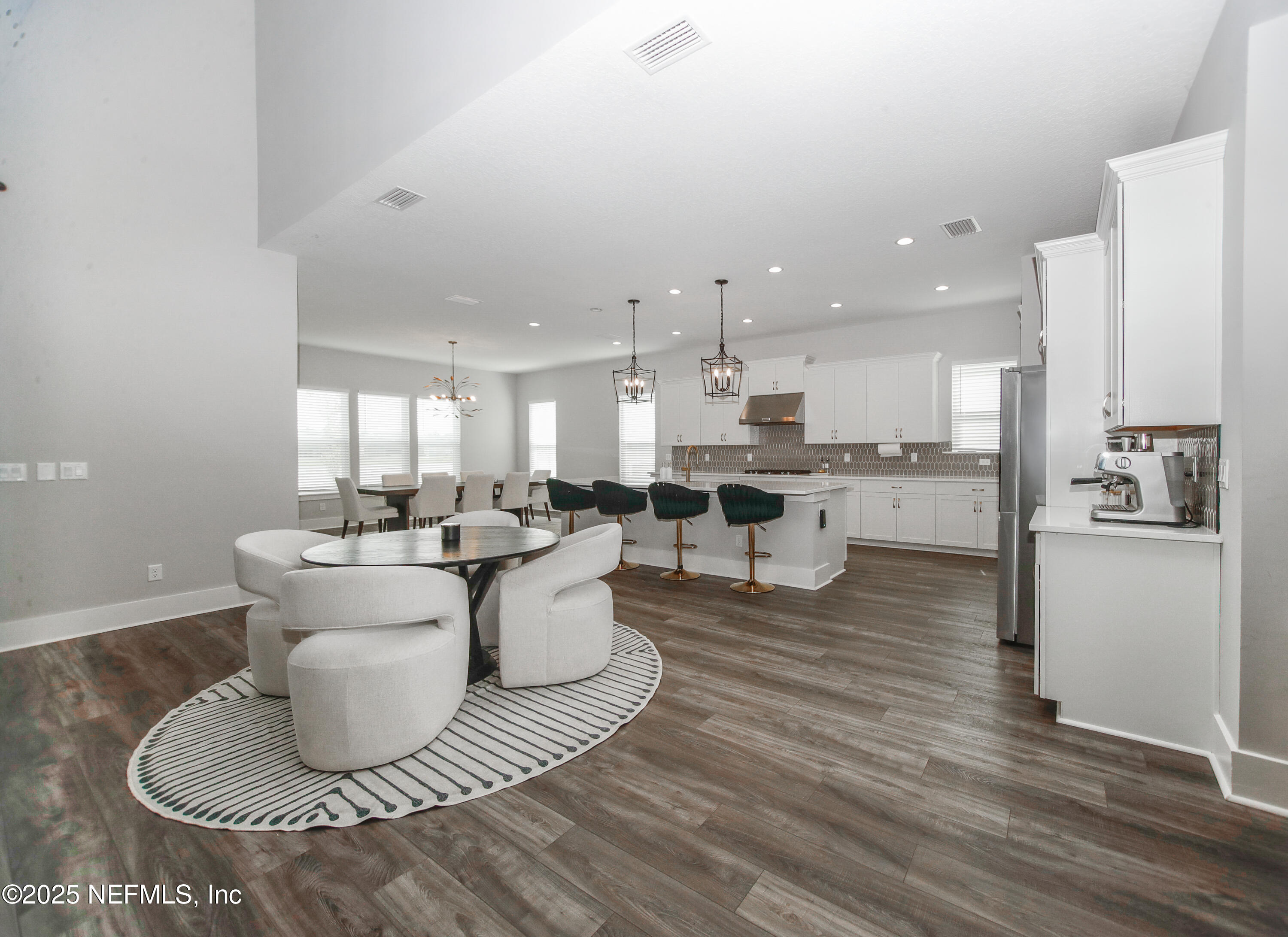 151 Hillendale Circle St. Johns, FL 32259 - Photo 7 of 39 a living room with kitchen island furniture and a kitchen view