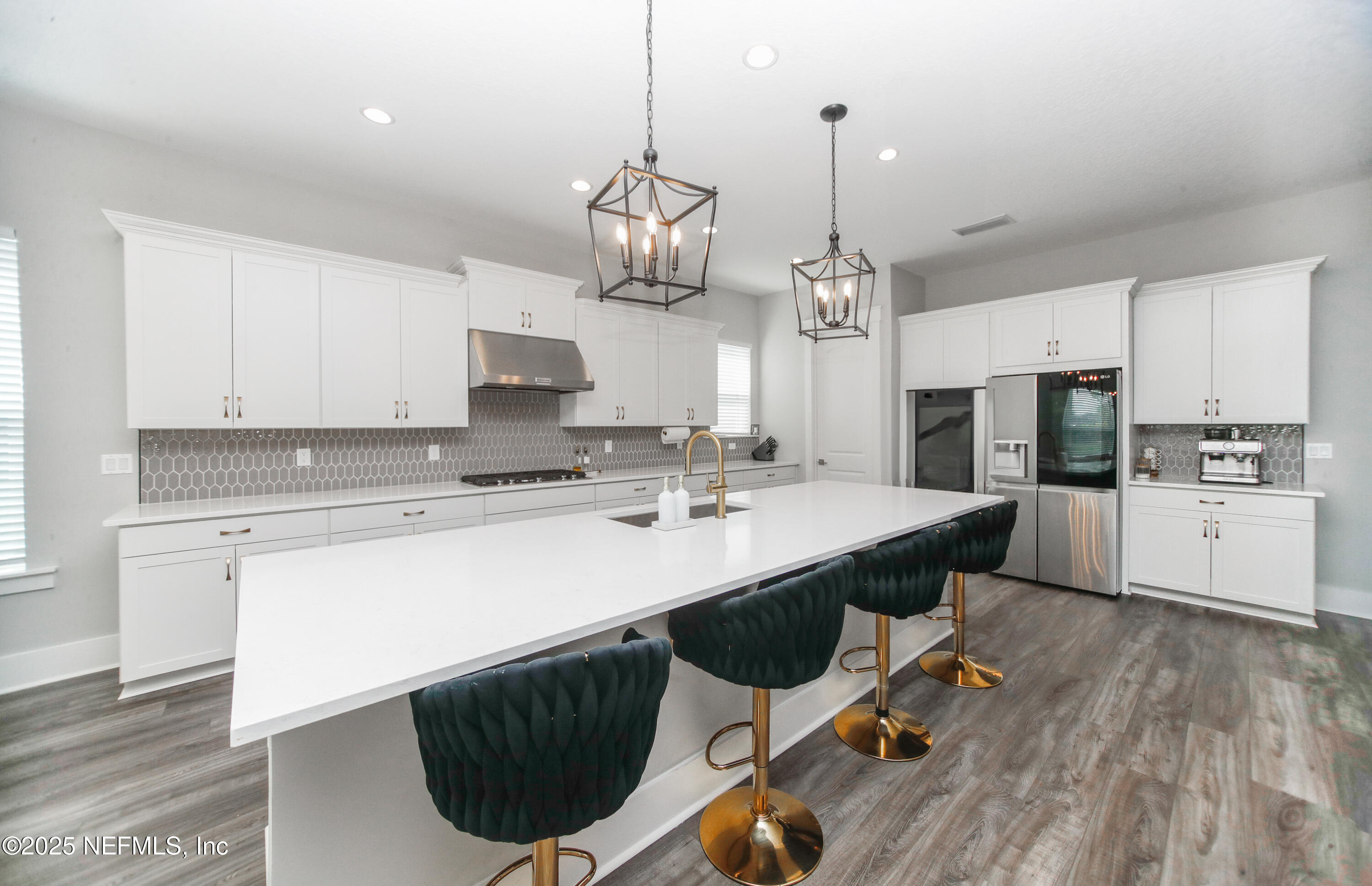 151 Hillendale Circle St. Johns, FL 32259 - Photo 10 of 39 a kitchen with a sink a center island cabinets and stainless steel appliances