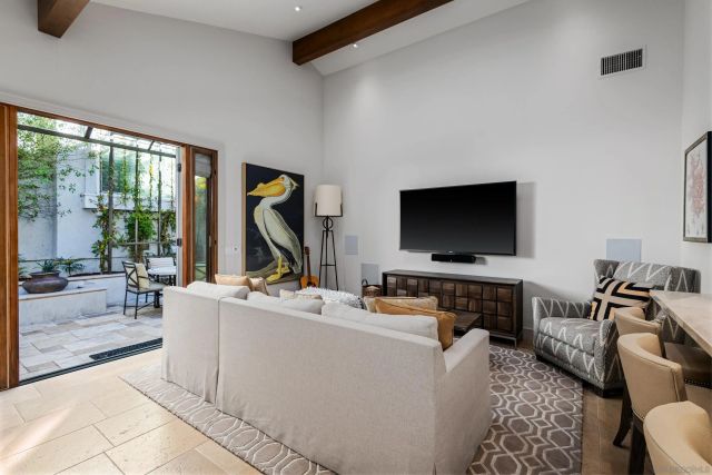 a bed sitting in a balcony next to a window