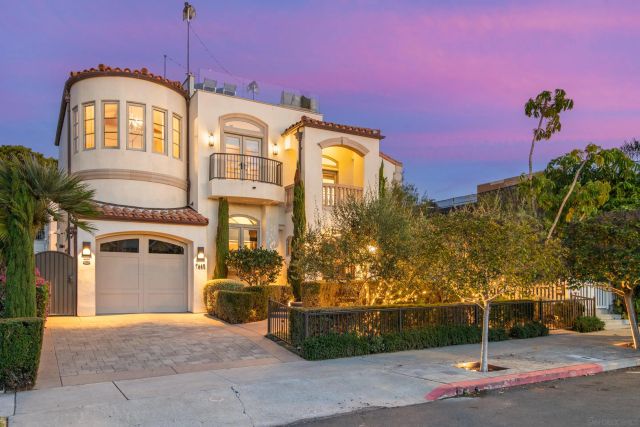 a patio with glass top table and chairs
