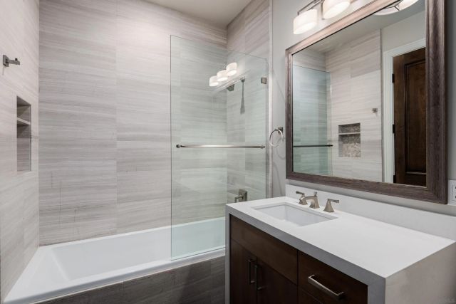 a view of residential houses with outdoor space and lakeside