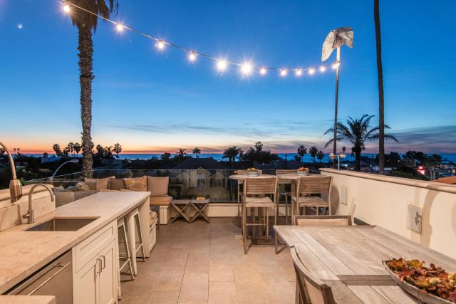 a view of a dining room with furniture and window