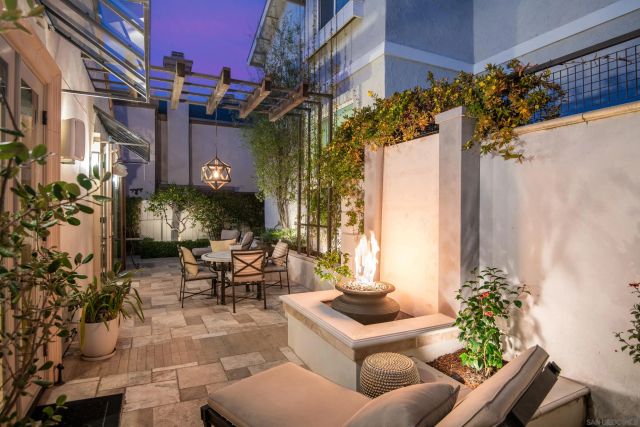 a living room with furniture fireplace and window