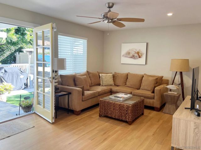 a livingroom with a couch and a flat screen tv