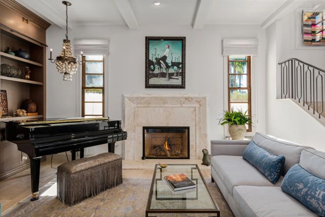 a kitchen with kitchen island granite countertop a sink and a stove