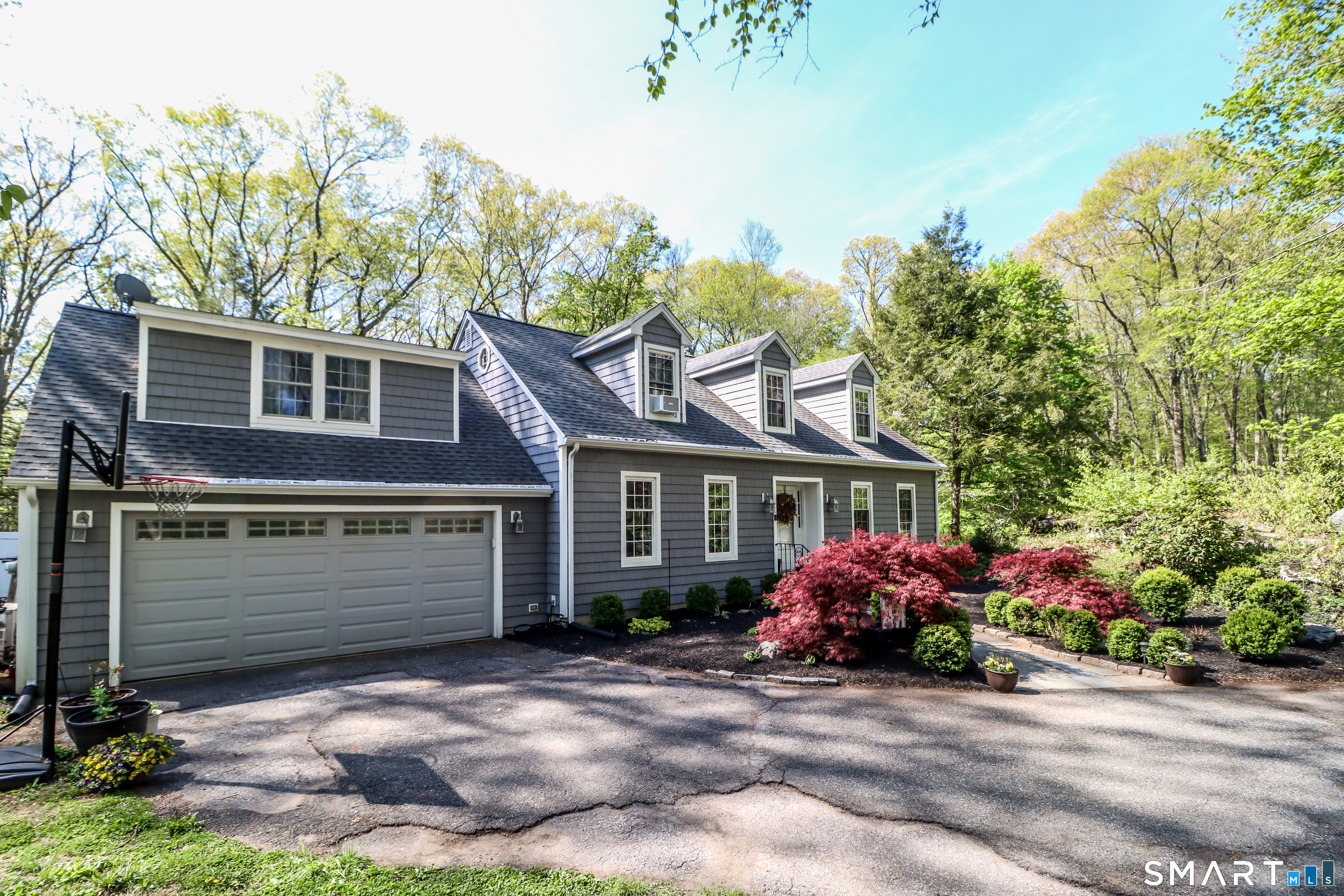 20 Puritan Valley Road Brookfield, CT 06804 - Photo 32 of 35 a front view of a house with garden