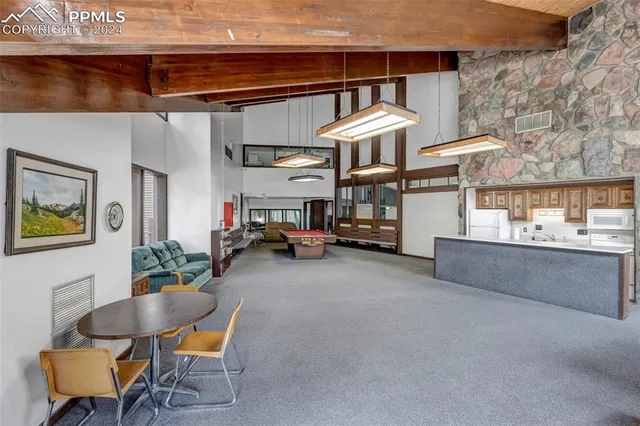 a view of a chairs and table in a patio