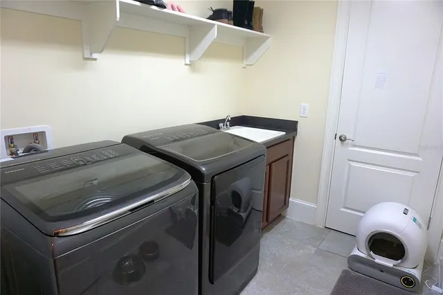 a utility room with dryer and washer