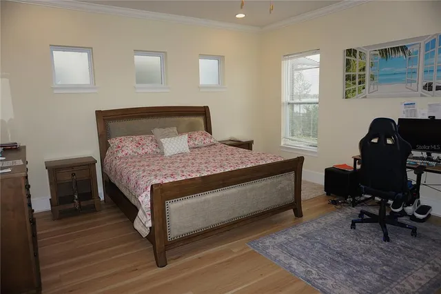 a bedroom with a bed and a desk