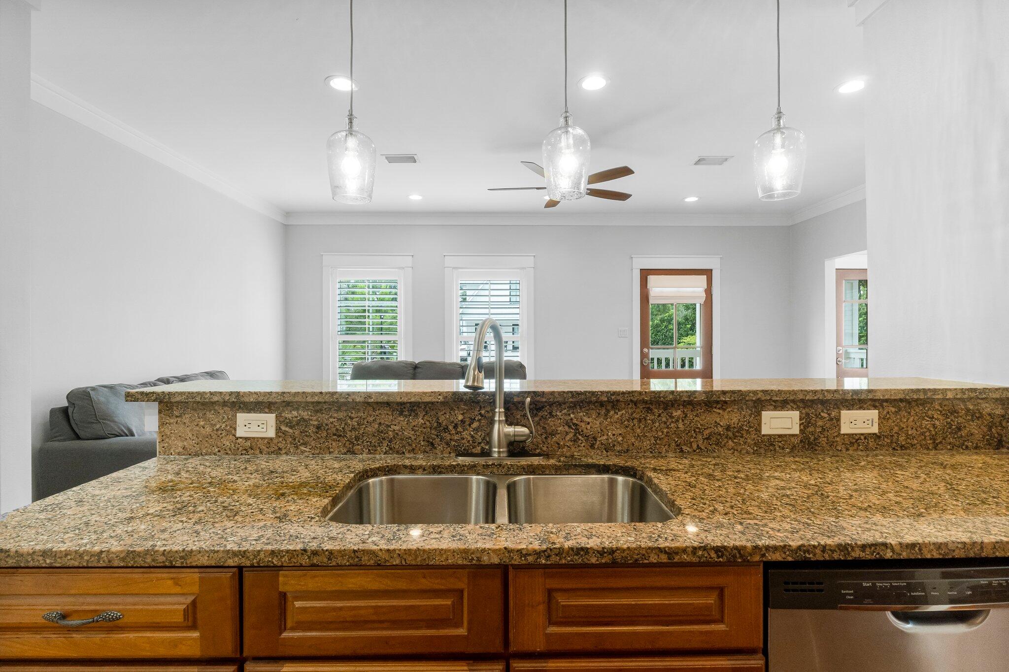 60 Willow Mist Road Inlet Beach, FL 32461 - Photo 16 of 57 a kitchen with granite countertop a sink a counter top space and stainless steel appliances