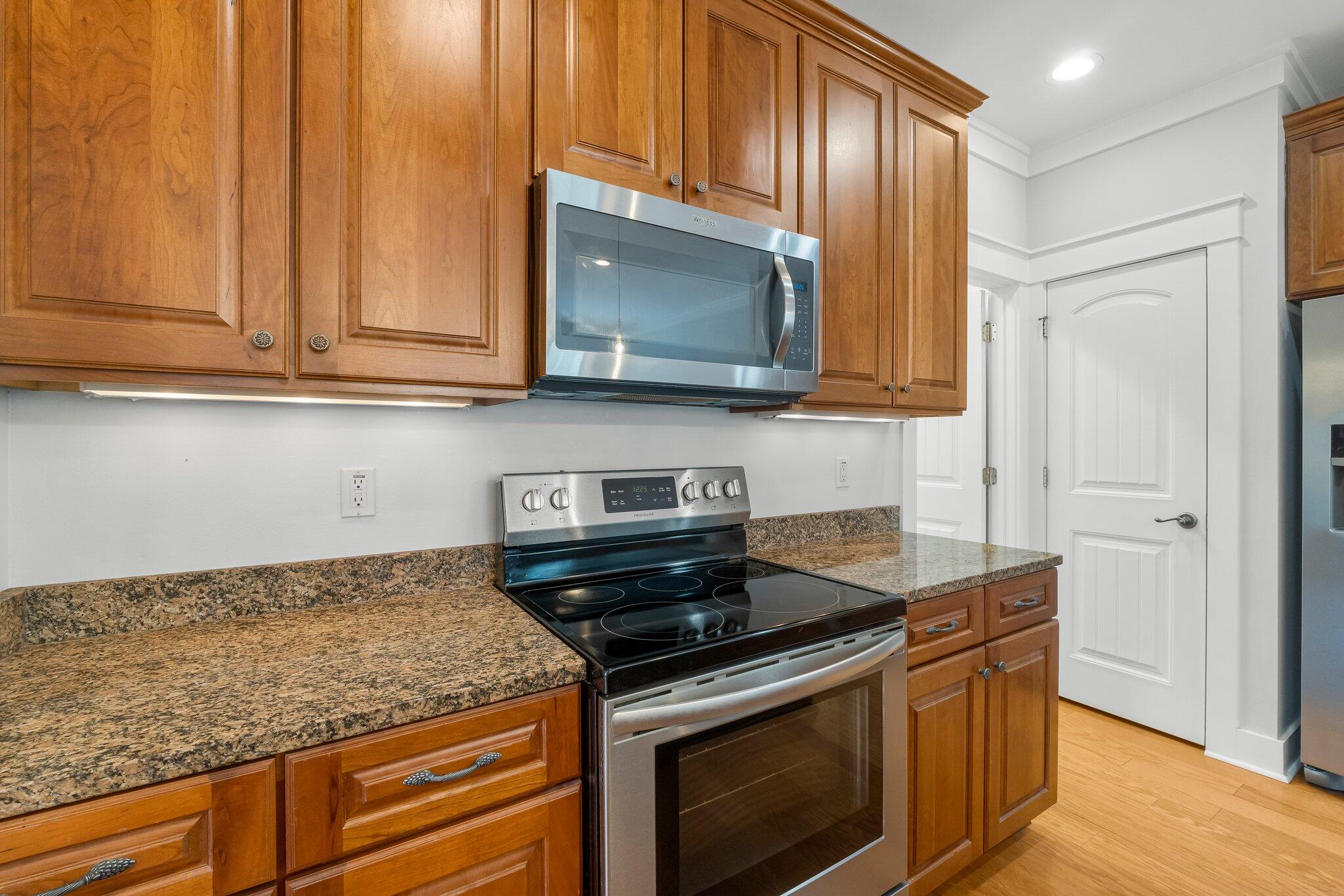 60 Willow Mist Road Inlet Beach, FL 32461 - Photo 17 of 57 a kitchen with granite countertop cabinets stainless steel appliances and wooden cabinets