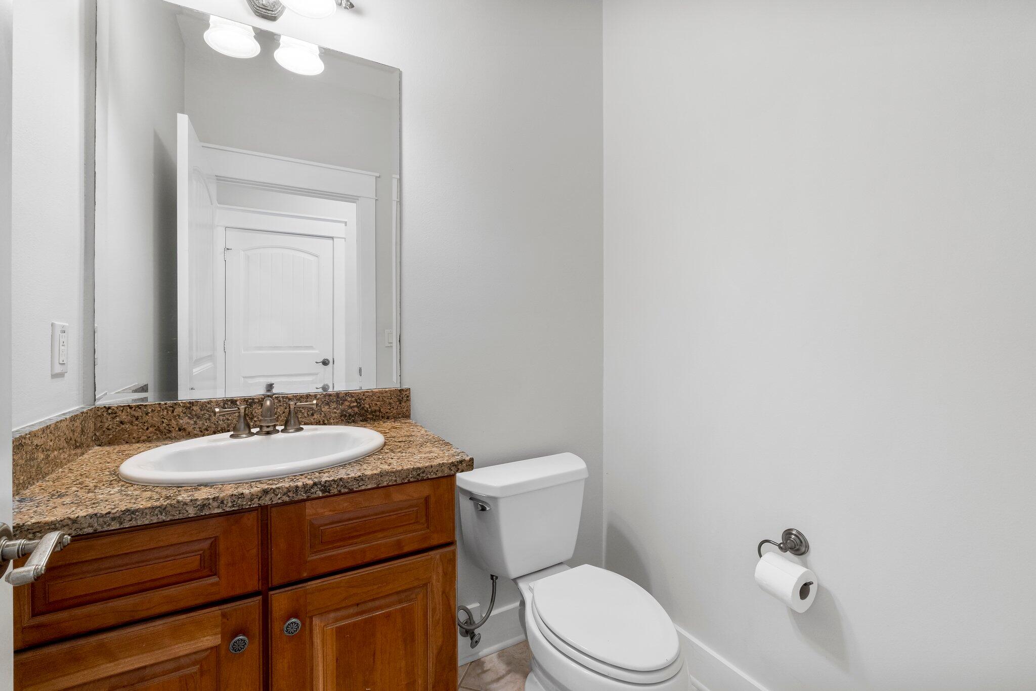 60 Willow Mist Road Inlet Beach, FL 32461 - Photo 18 of 57 a bathroom with a granite countertop toilet sink and mirror