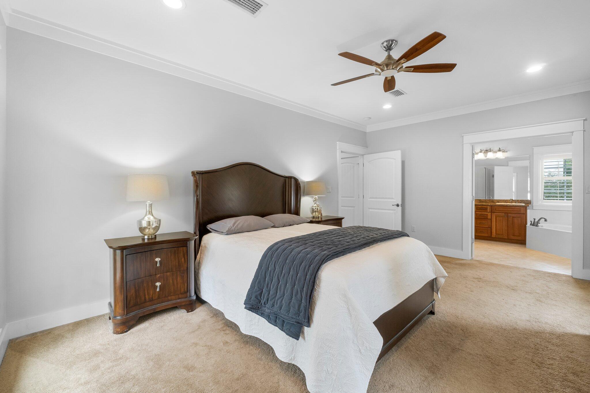 60 Willow Mist Road Inlet Beach, FL 32461 - Photo 19 of 57 a bedroom with a large bed and a chandelier