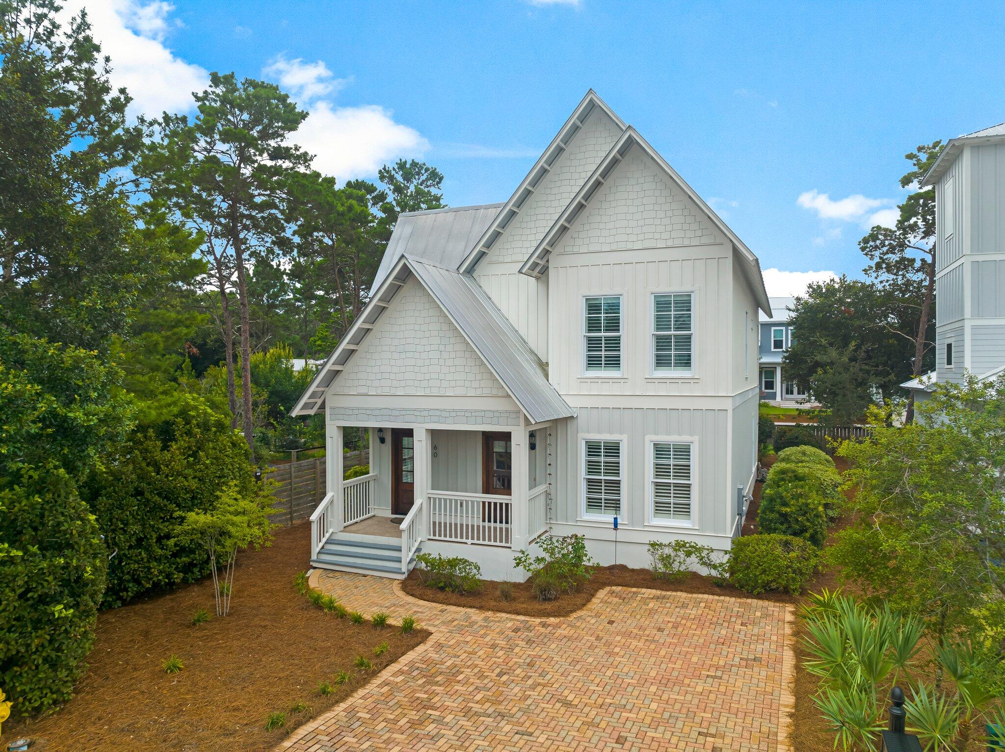 60 Willow Mist Road Inlet Beach, FL 32461 - Photo 2 of 57 a front view of a house with garden