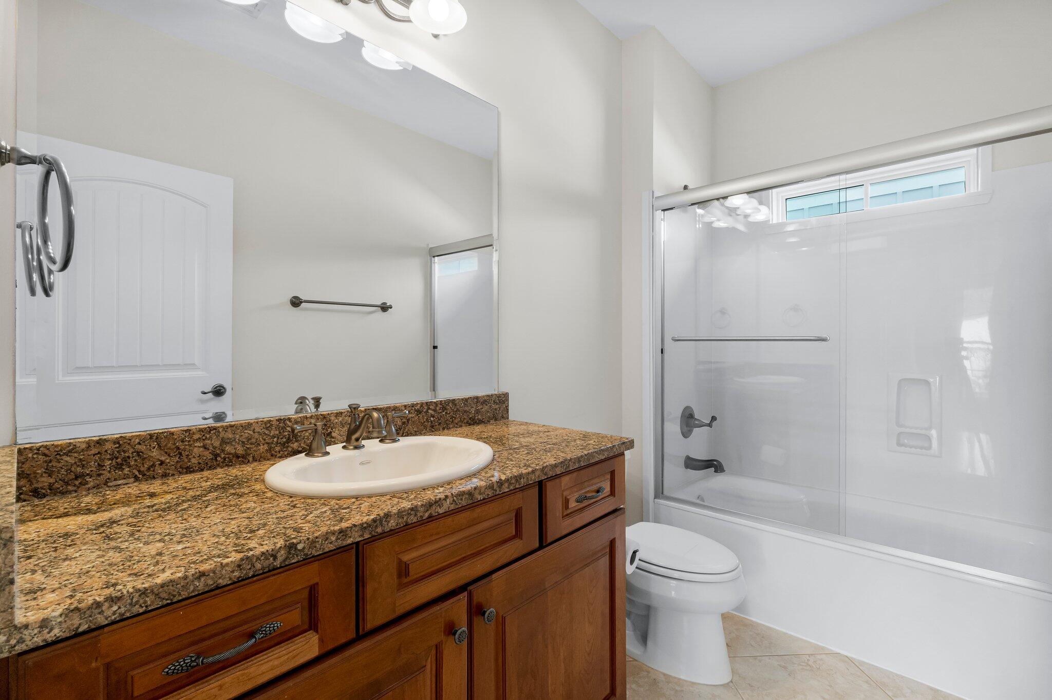60 Willow Mist Road Inlet Beach, FL 32461 - Photo 26 of 57 a bathroom with a granite countertop sink toilet mirror and shower