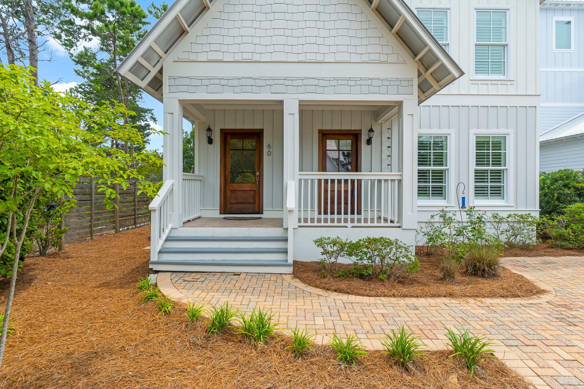 60 Willow Mist Road Inlet Beach, FL 32461 - Photo 4 of 57 a front view of a house with a garden