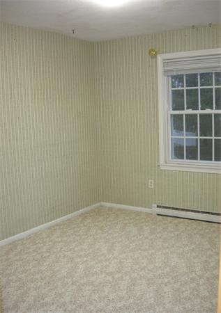 118 Worthen Road Lexington, MA 02421 - Photo 12 of 15 a view of an empty room with a window