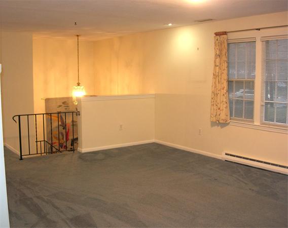 118 Worthen Road Lexington, MA 02421 - Photo 5 of 15 an empty room with windows