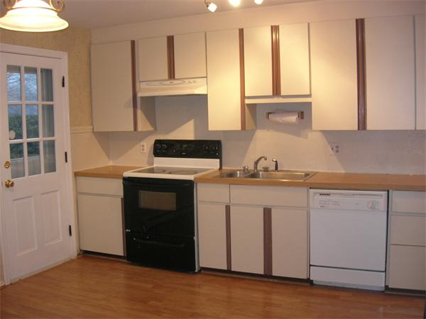 118 Worthen Road Lexington, MA 02421 - Photo 7 of 15 a kitchen with stainless steel appliances granite countertop a stove a sink and a microwave