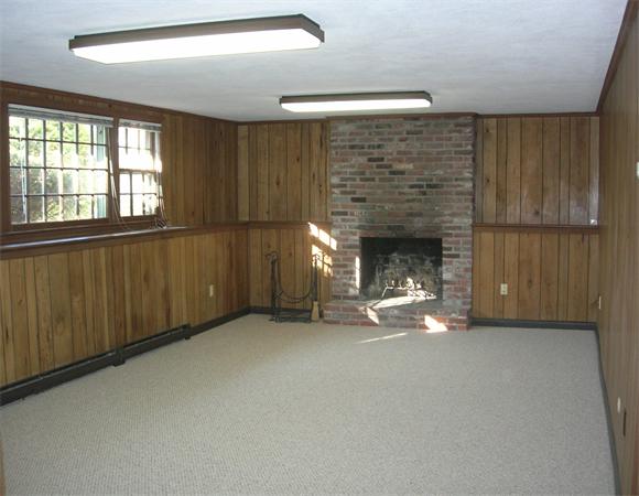 118 Worthen Road Lexington, MA 02421 - Photo 9 of 15 a view of empty room with fireplace and windows