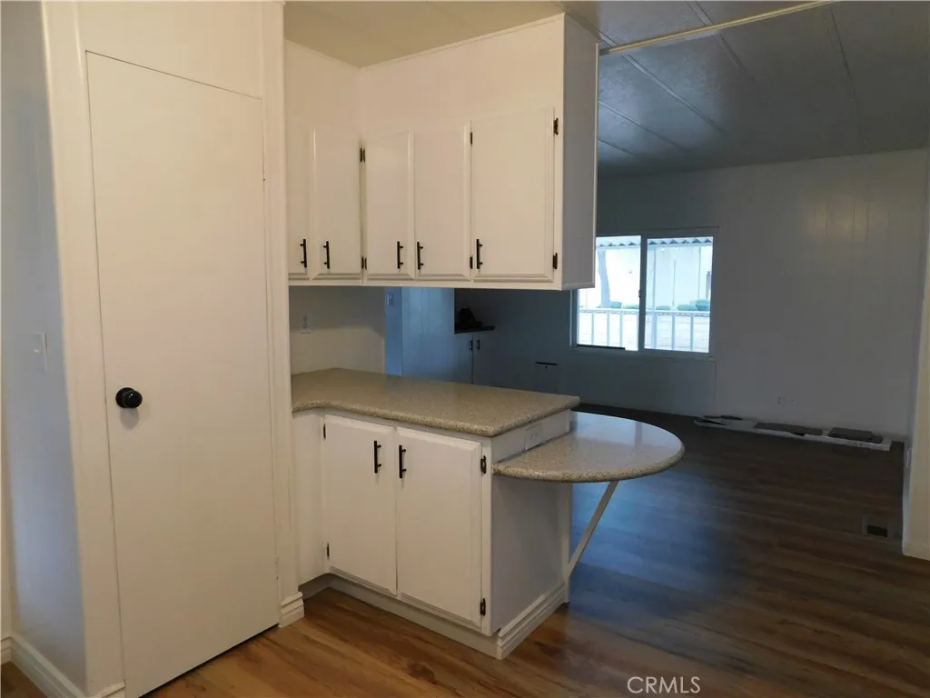5700 West Wilson Street, Unit 1 Banning, CA 92220 - Photo 20 of 49 a kitchen with a sink and cabinets