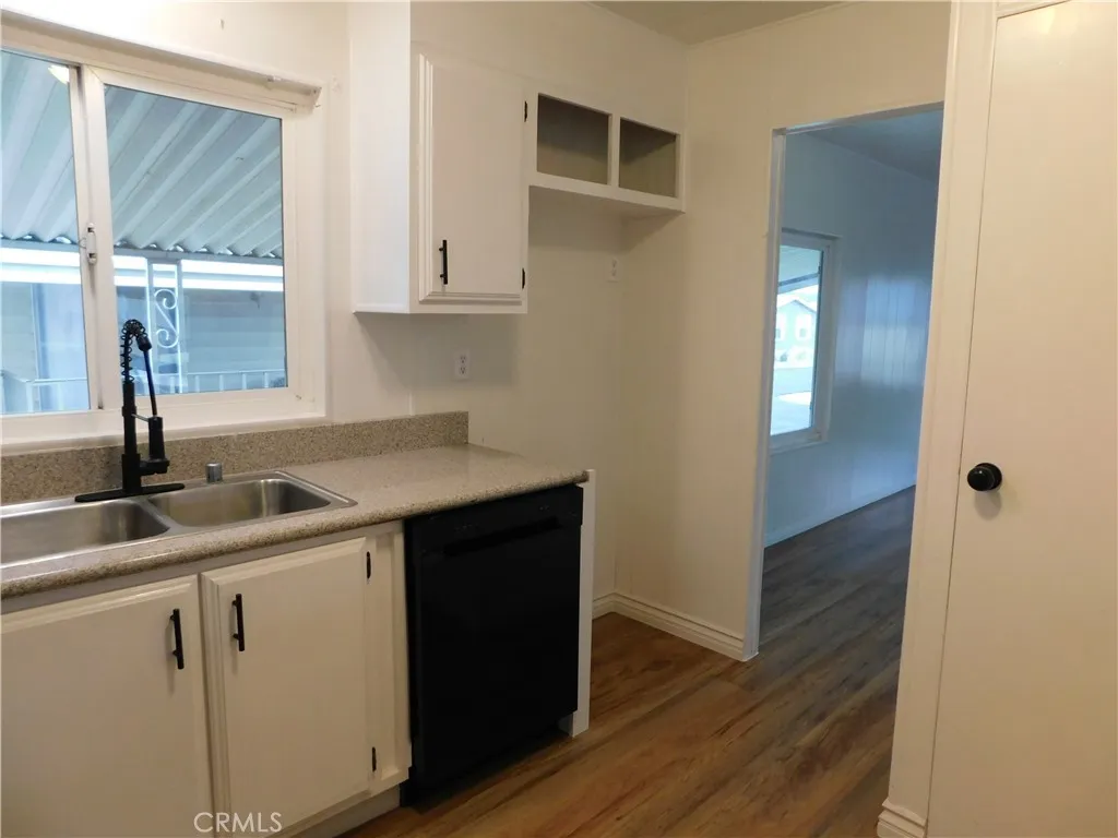 5700 West Wilson Street, Unit 1 Banning, CA 92220 - Photo 24 of 49 a kitchen with a sink and cabinets