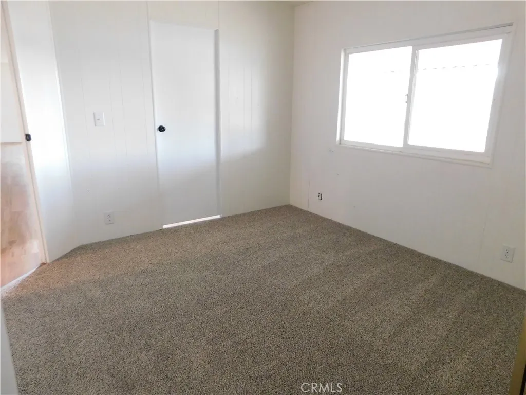 5700 West Wilson Street, Unit 1 Banning, CA 92220 - Photo 34 of 49 an empty room with a window