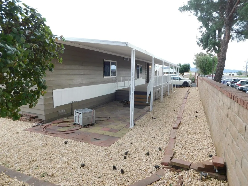 5700 West Wilson Street, Unit 1 Banning, CA 92220 - Photo 46 of 49 a backyard of a house with table and chairs