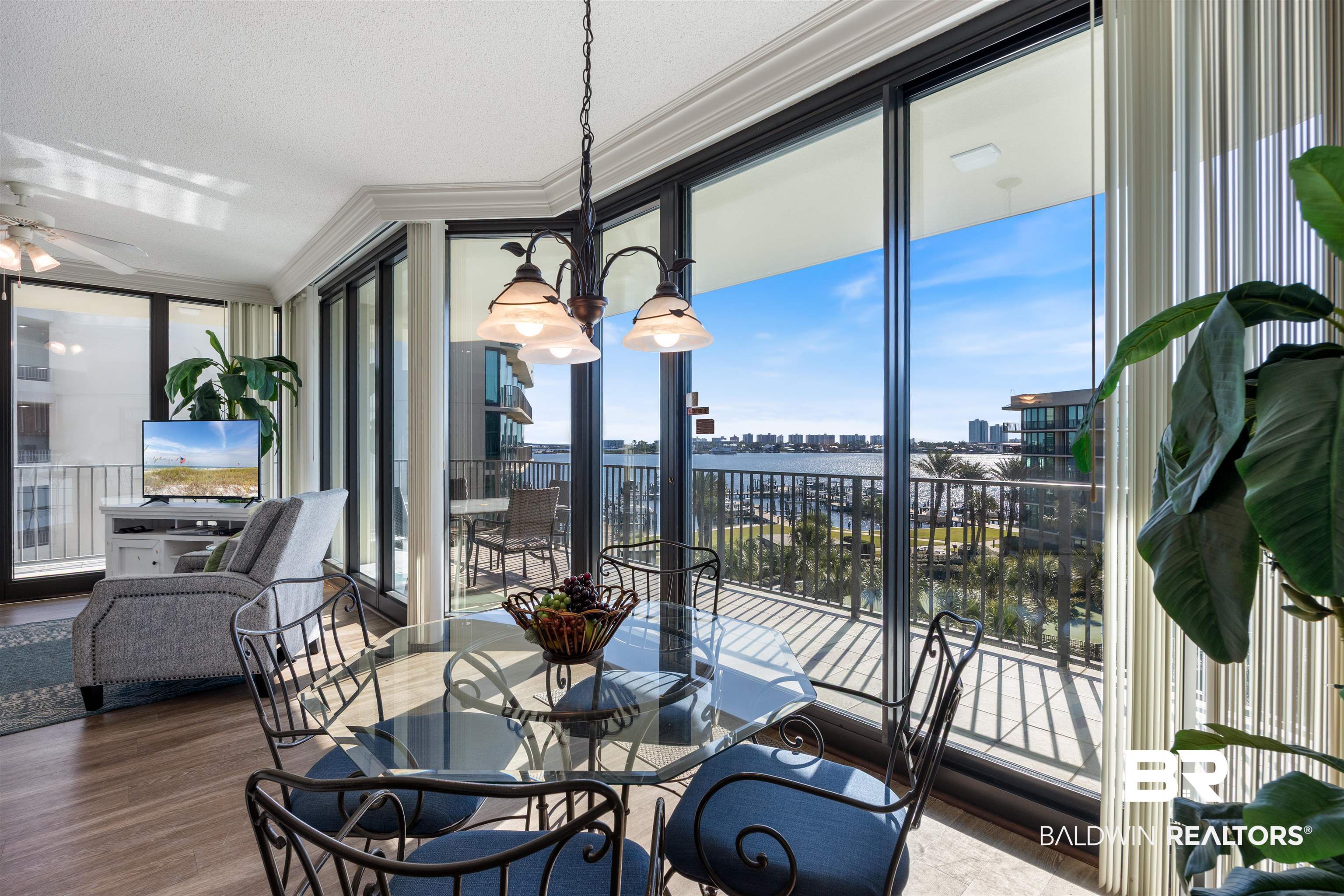 27580 Canal Road, Unit 1431 Orange Beach, AL 36561 - Photo 14 of 73 Sunroom / solarium with a water view and a chandelier