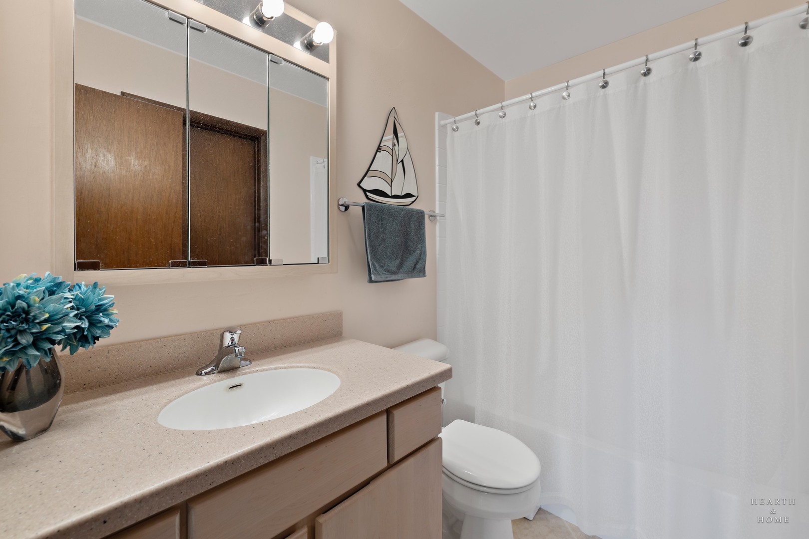 404 Lucille Avenue Fox River Grove, IL 60021 - Photo 12 of 36 a bathroom with a sink toilet and mirror