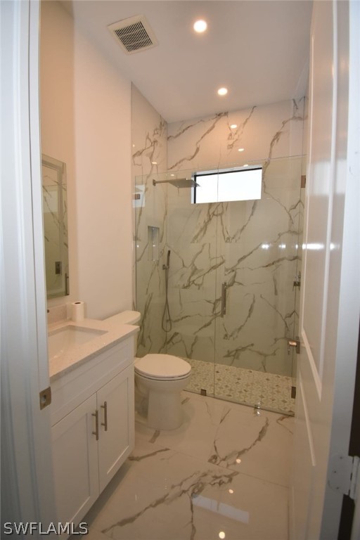 3685 Randall Boulevard Naples, FL 34120 - Photo 13 of 32 a bathroom with a granite countertop sink a toilet and shower