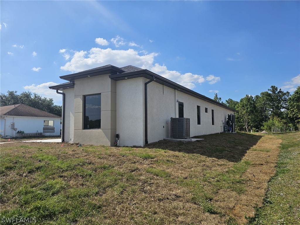 3685 Randall Boulevard Naples, FL 34120 - Photo 2 of 32 a view of a house with a yard