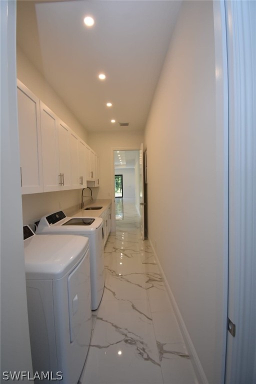 3685 Randall Boulevard Naples, FL 34120 - Photo 26 of 32 a kitchen with a sink a stove and cabinets